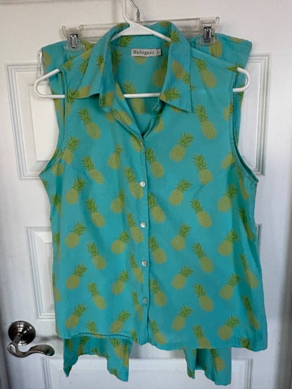 Summer PJs. Sleeveless Button-down top with drawstring shin length pants.